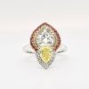 Diamond Ring with Yellow/Orange Sapphire Set in Platinum